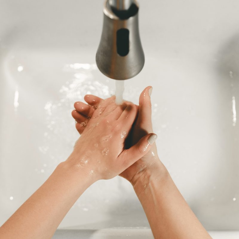 washing hands in sink