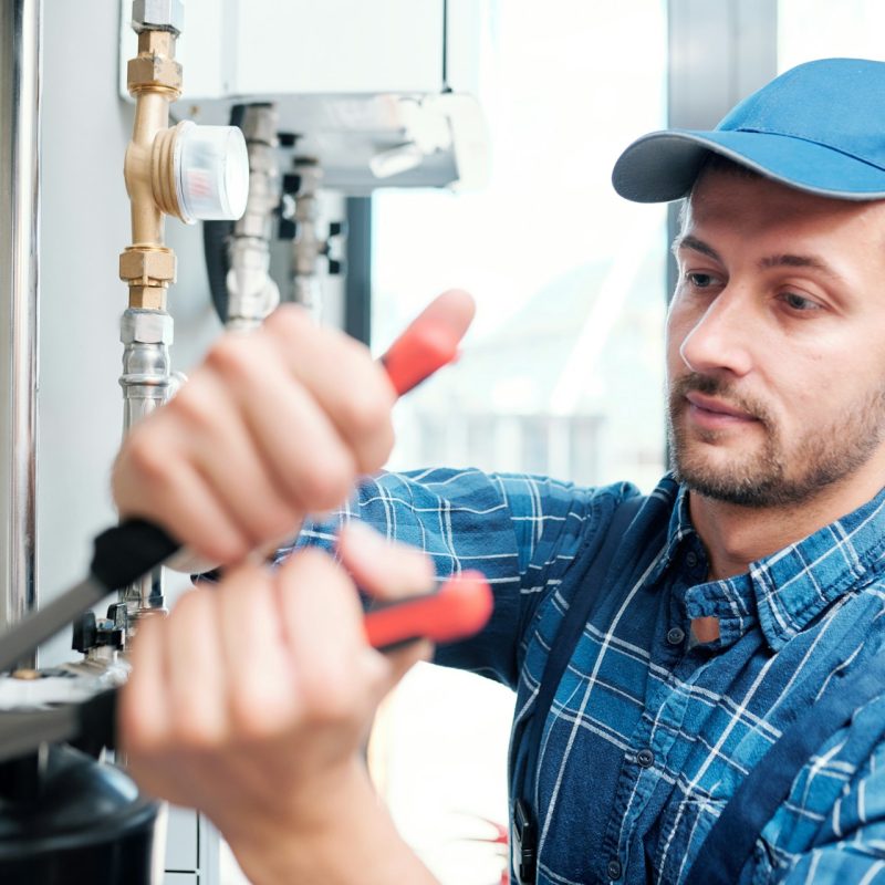 plumber fixing pipes